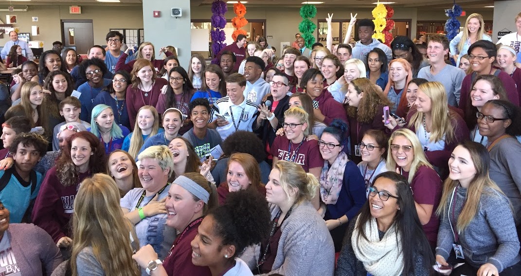 Group photo with Lea at center (cropped)